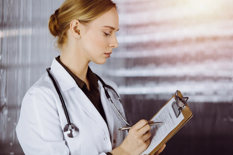 Member of a clinical study reviewing a patient's information.
